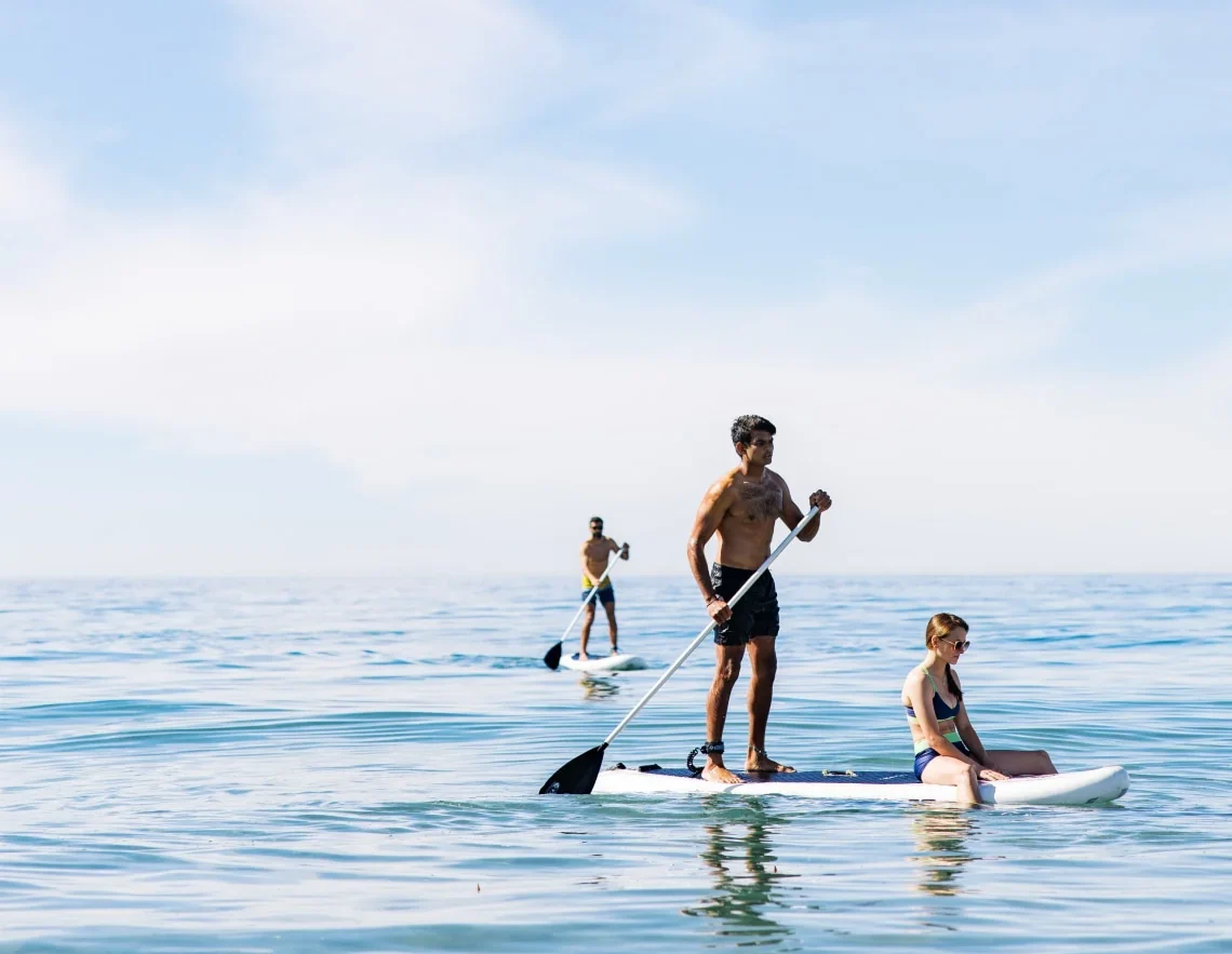 A couple kayaking together on the Pacific Ocean